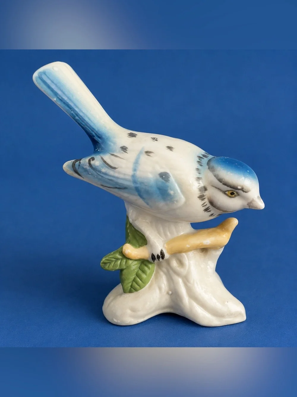 Vintage Hand-Painted Blue Bird Porcelain Figurine on Tree Stump – Songbird
